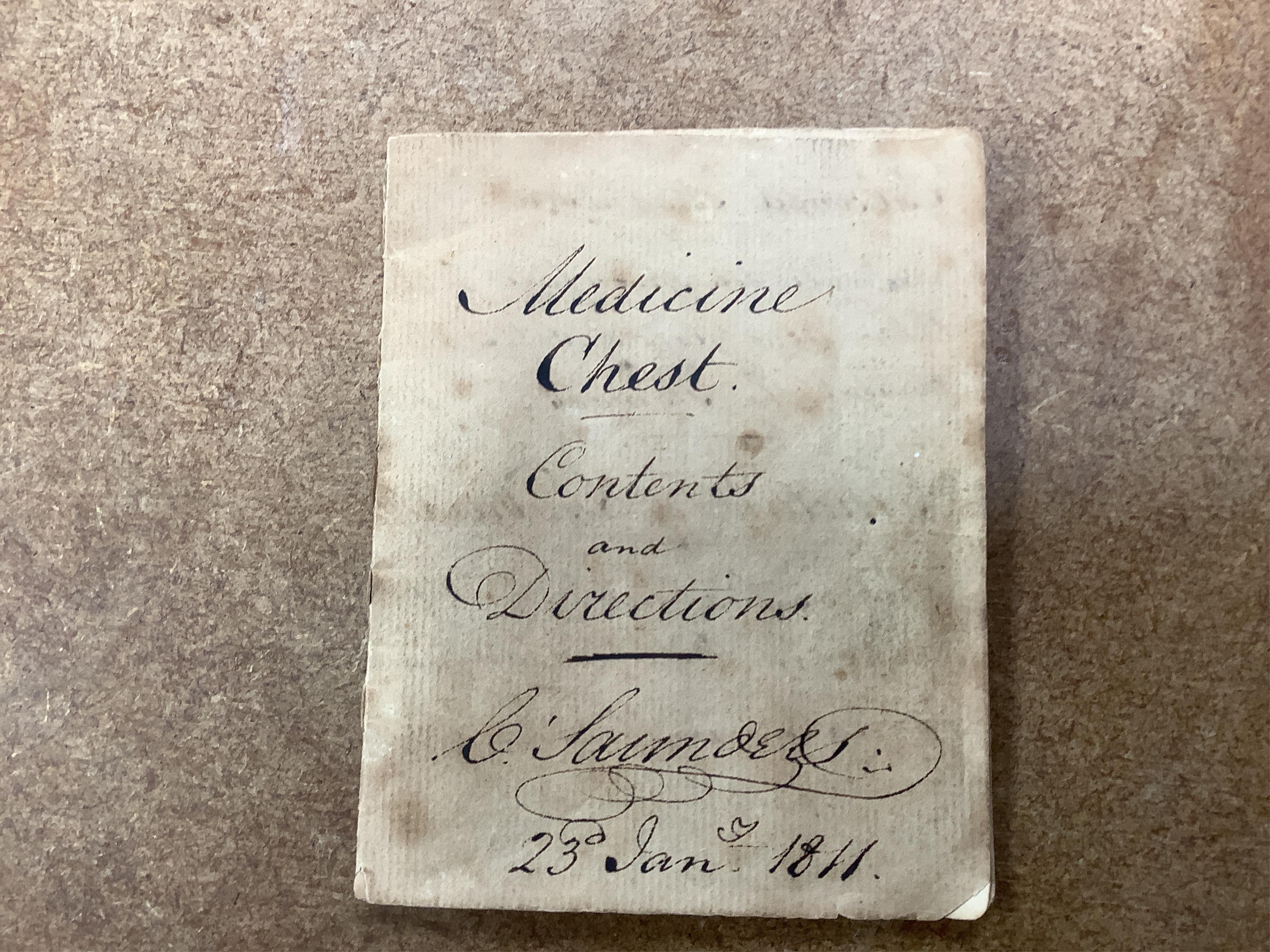 A 19th century mahogany apothecary cabinet, interior with fitting compartments containing twenty-one glass bottles, most with stoppers, five drawers with ivory knobs containing a miniature pestle and water, mixing glasse